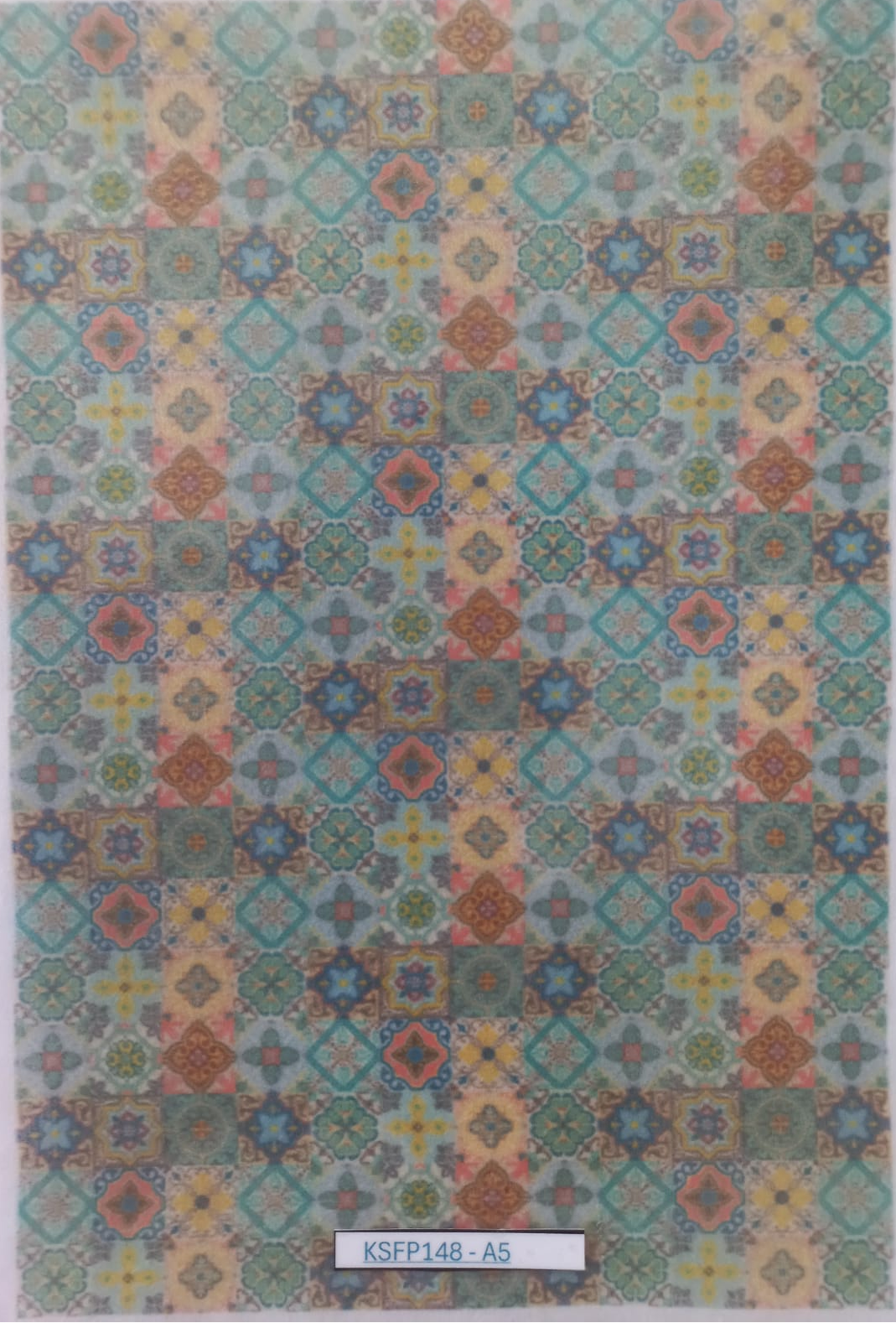 A rectangular sheet of patterned adhesive tape or sticker featuring a colorful geometric tile design, shown flat against a white background.