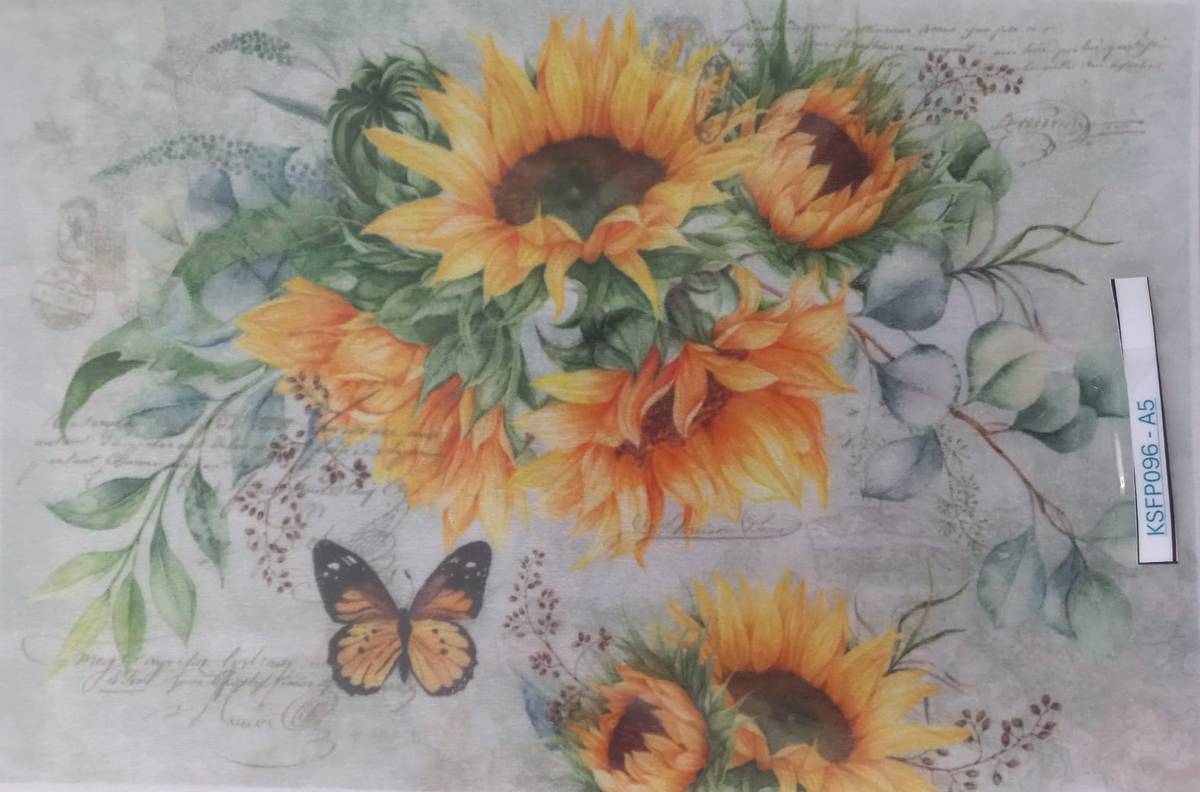 A square decorative print or card featuring a floral design with large yellow sunflowers, green leaves, and a small orange-and-black butterfly on a pale gray background with faint script text. The item appears to be photographed flat, with a small white label strip visible on the right side.