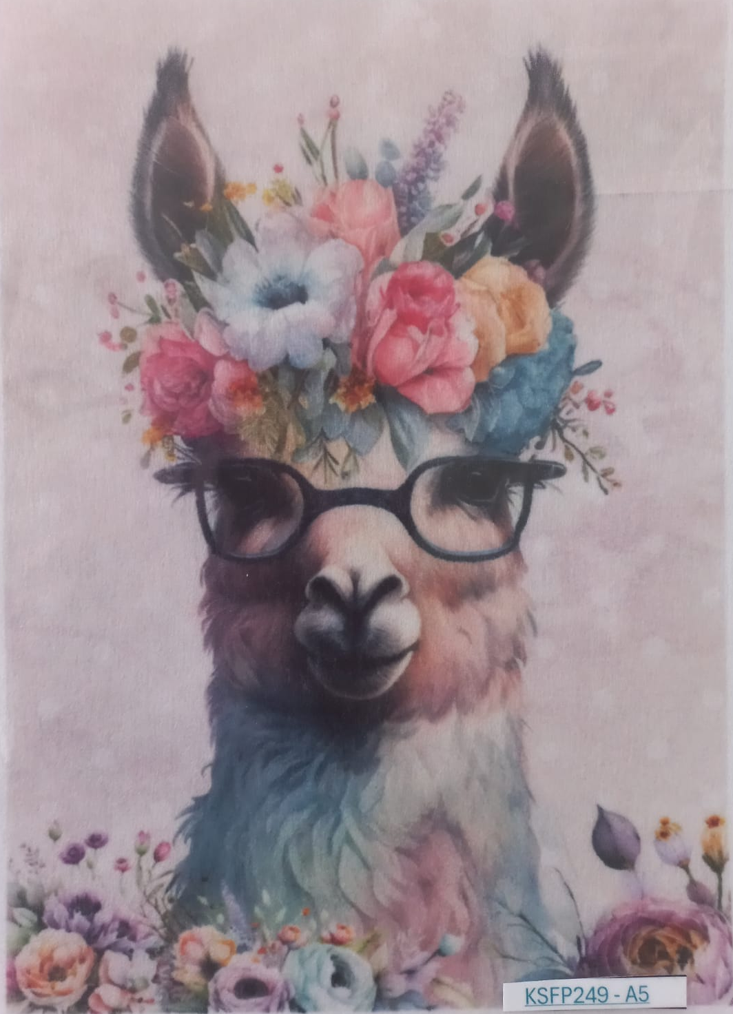 A square art print or card featuring a stylized llama or alpaca face with black glasses and a colorful floral crown, surrounded by flowers at the bottom, on a pale pink background. A small label reading KSFP249-A5 is visible in the lower right corner.