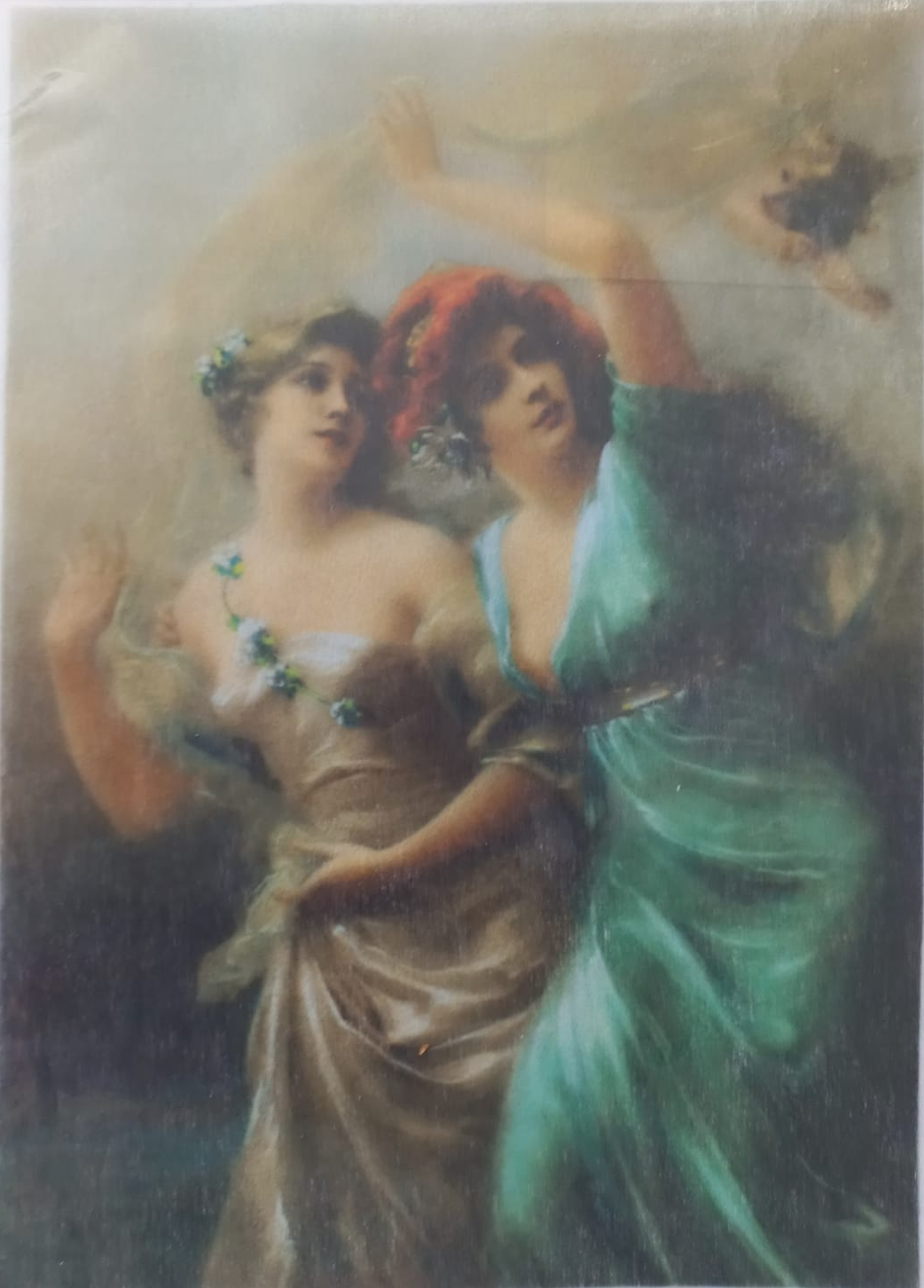 A vintage-style classical painting print depicting two elegant women in flowing drapery, one in beige and one in teal-green, enclosed in a clear protective plastic sleeve.