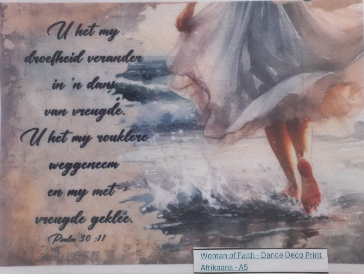 A square decorative print or card featuring a watercolor-style illustration of a woman in a flowing dress walking through shallow water, with Dutch text on the left and a small label at the bottom reading 'Woman of Faith - Dance.Deco Print Afrikaans - AS'.