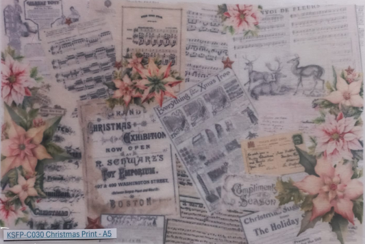 A square Christmas art print featuring vintage newspaper clippings, musical sheet music, pomegranate illustrations, and holiday text, presented inside a clear plastic sleeve. A label at the bottom left reads 'KSFP-C030 Christmas Print -A5'.