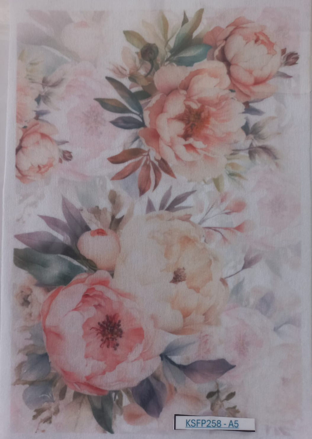 A sheet of temporary tattoos featuring a watercolor floral design with large pink and peach peonies, green leaves, and soft gray-blue accents, packaged in a clear plastic sleeve.