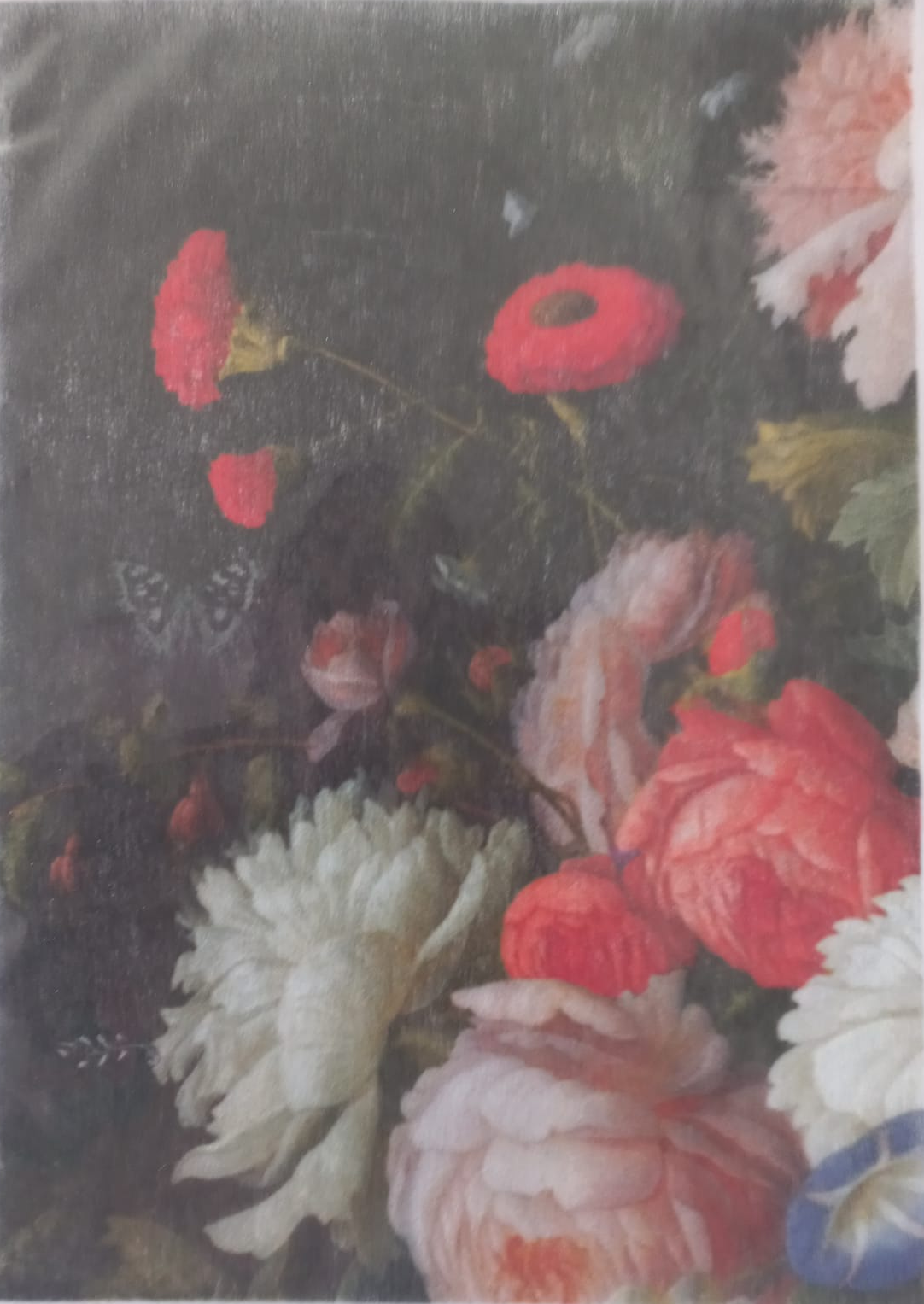 A close-up of a floral artwork showing large white and pink flowers with red blossoms against a dark background, photographed with a slight glare on the left side.