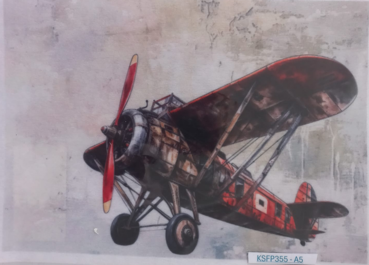 A printed illustration of a vintage biplane in red, black, and silver tones, shown inside a clear protective sleeve with a small label reading KSFP355-A5 at the bottom.