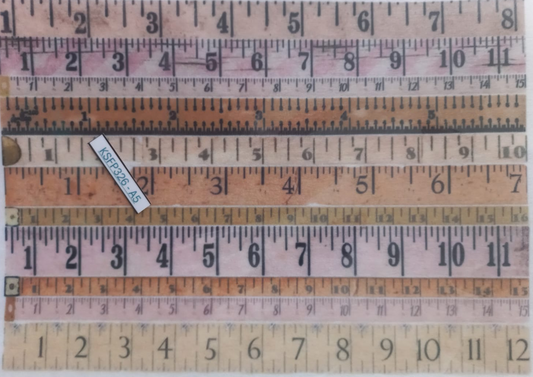 A set of vintage wooden folding rulers with black printed measurements, displayed in a clear plastic sleeve. The rulers show various sizes and colors including beige, brown, and pinkish wood tones, with one ruler displaying 'AS22828-A3'.