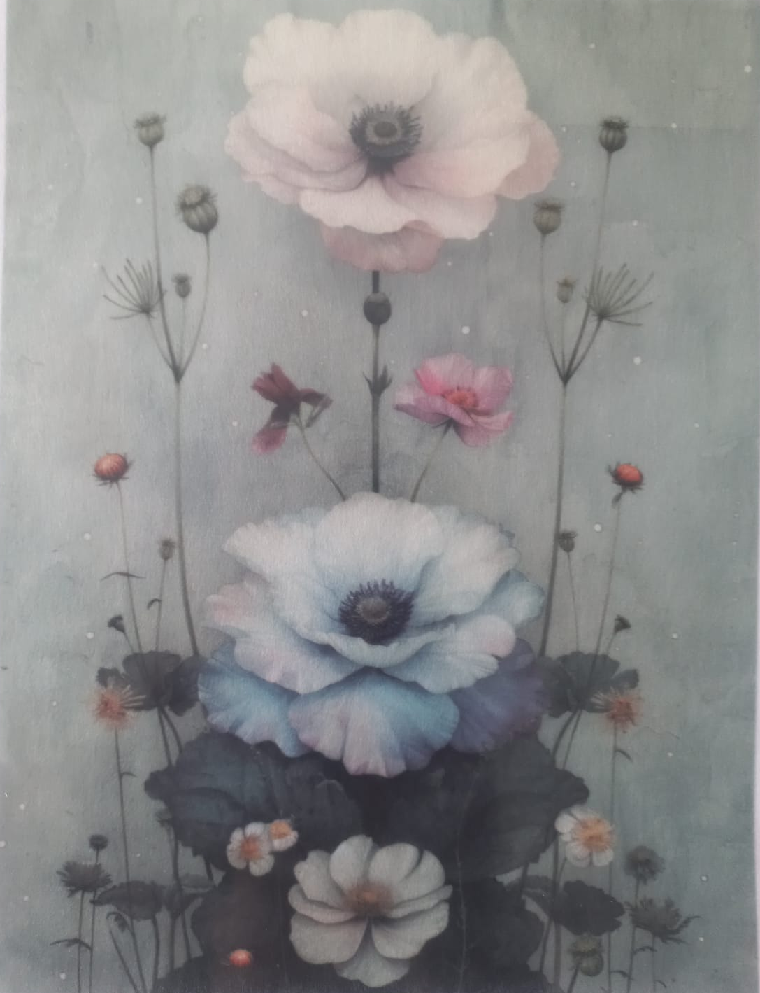 A botanical art print featuring large anemone-like flowers in soft pastel tones, including pale pink, light blue, white, and dark green leaves, set against a muted sage-gray background. The print has a white border with small printed text along the top and bottom.