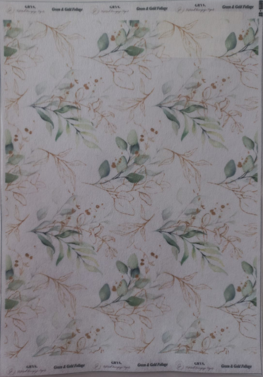A sheet of patterned paper featuring a repeating design of green eucalyptus leaves and delicate gold botanical outlines on a white background, with 'Green & Gold Foliage' printed at the top and bottom.