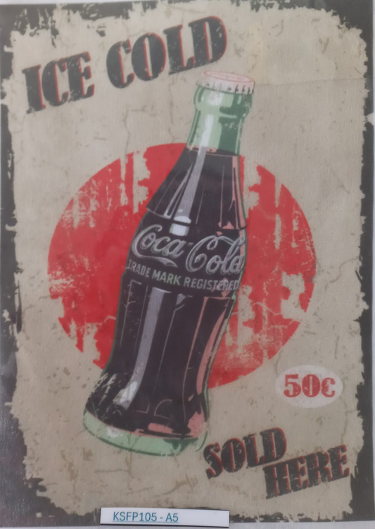 A vintage-style Coca-Cola advertising print or poster showing an ice-cold glass bottle with a red circular background and distressed text reading 'ICE COLD' and 'SOLD HERE'. The print is photographed inside a clear protective sleeve on a white background.