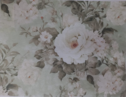 A rectangular sheet of floral-patterned craft vinyl or contact paper featuring large white and cream roses with muted green and gray leaves on a pale sage background, with printed labels along the edges.
