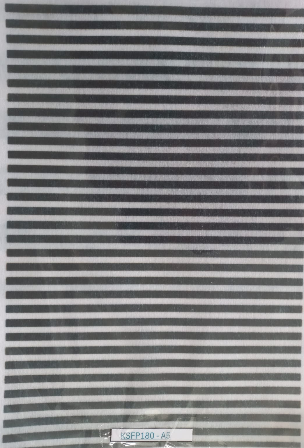 A sheet of black and white horizontally striped adhesive tape, sealed in a clear plastic bag, with a small white label at the bottom reading 'KSFP180-A5'.