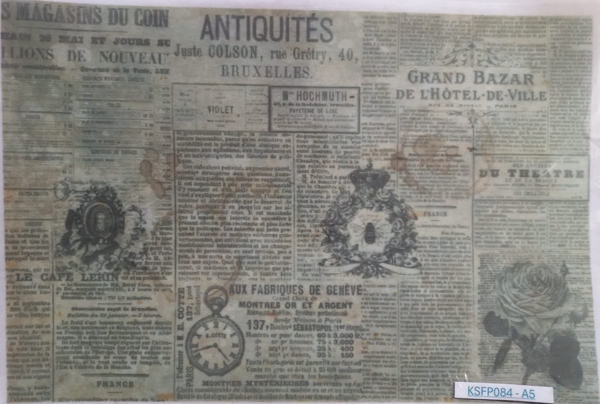 A vintage French newspaper print with multiple columns of aged newspaper text, illustrated floral and crest graphics, and a small label in the bottom right corner reading KSFP084-A5.