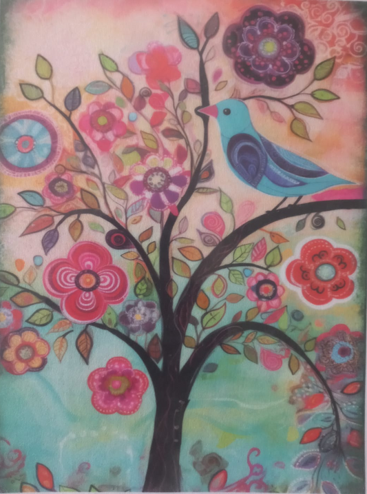 A colorful art print or painting featuring a stylized tree with branches, flowers, leaves, and a blue bird, photographed against a white background with printed margins visible on the left and right sides.