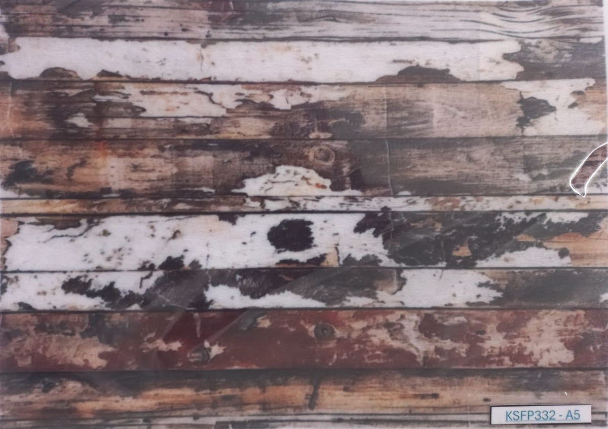 A rectangular printed backdrop or sheet featuring a distressed, weathered wood plank pattern with peeling white paint and exposed brown wood, photographed against a white background.